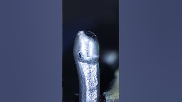 Melting wire solder in macro #asmr #satisfying #shorts