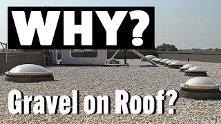 Why is gravel often placed on flat roofs?