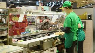 Subway Staff Preparing Sandwiches