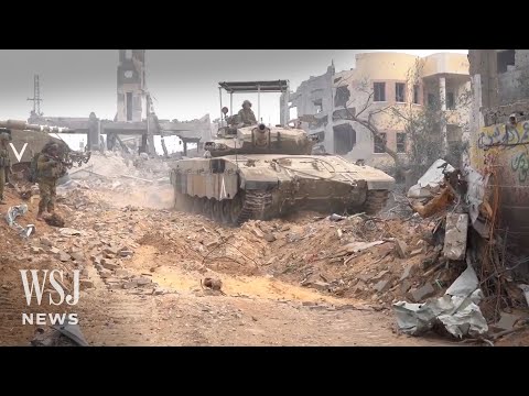 В репортаже изображены танки Merkava 3 с козырьком