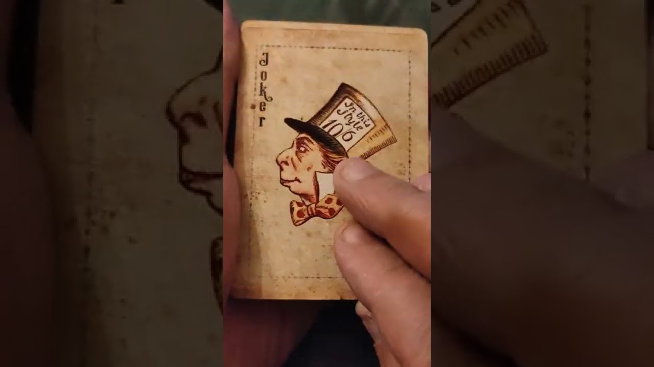 A curious deck of Alice playing cards flip through