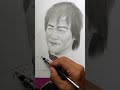 menggambar sketsa wajah seorang aktor legendaris film kungfu Bruce Lee