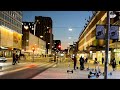 Stockholm Walks: Klarabergsgatan. City center and its lights and people. Yellow &amp; blue for Ukraine