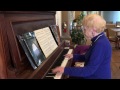 Hospice Austin Volunteer Barbara Brenny playing piano at Hospice Austin&#39;s Christopher House