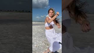 Dance on the seashore in a white dress