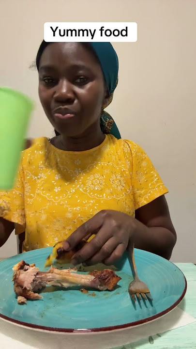 Eating Yummy chicken with grilled ripe plantain and biscuits