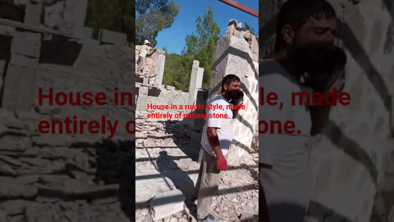 House in a rustic style, made entirely of natural stone.