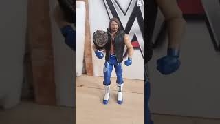 aj styles entrance wearing a hood with  championship belt