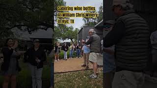 sabering wine bottles at William Chris winery in Hye, TX #wine #texaswine #mouvedre #sabervinos