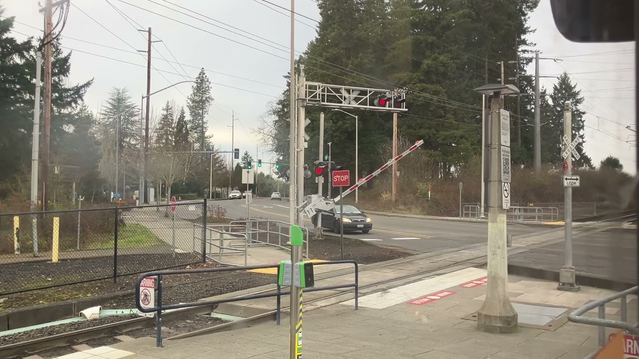 Crossing Gate goes down for MAX Rail City Train at Merlo Rd./158th Ave. RR Crossing in Portland OR