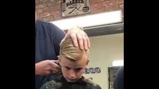 Barber pranks this kid by pretending he has cut his ear Off