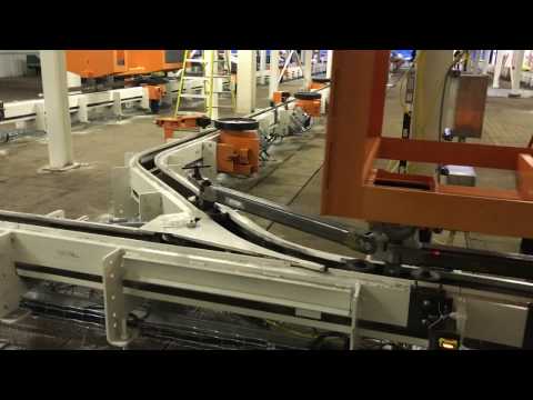ASI's Inverted Friction Carrier Traveling A Through Track Switch - video from Automatic Systems