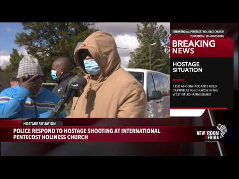 Police try to defuse an ongoing hostage situation at the Pentecost Holiness church