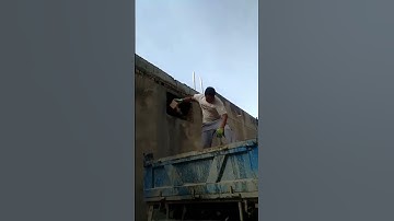 very skilled worker catches brick without looking
