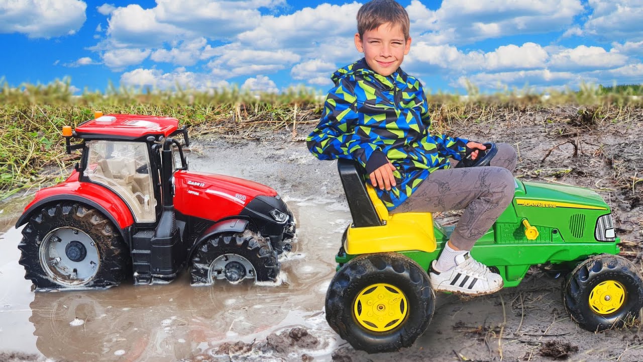 Kyryl Plays with Tractors in the Mud and Helps to pull the Tractor YouTube