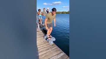 Guy using water bottles to run on water
