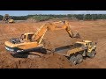 Hyundai Robex 300LC-9S loading Cat and Volvo ADT`s part 3