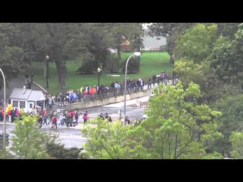 Vets marching past White House carrying baracades from the monuments