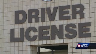 Residents stand in long, hot lines waiting to renew driver’s licenses