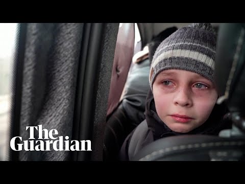 'We left our Dad in Kyiv': young Ukrainian boy in tears after fleeing capital