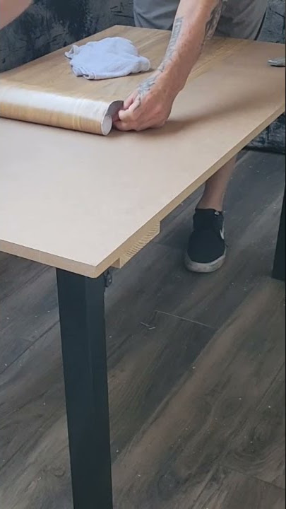 Installing vinyl peel and stick wallpaper on table top