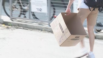 Employees carry out belongings after US State Department layoffs