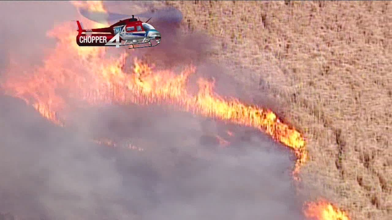 Crews battle several area fires, including large marsh fire