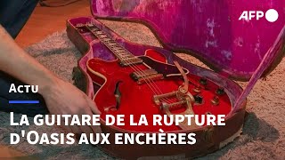 La guitare de la rupture d'Oasis aux enchères à Paris | AFP