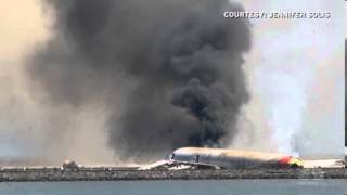 Video shows passengers fleeing Asiana jet after crash.