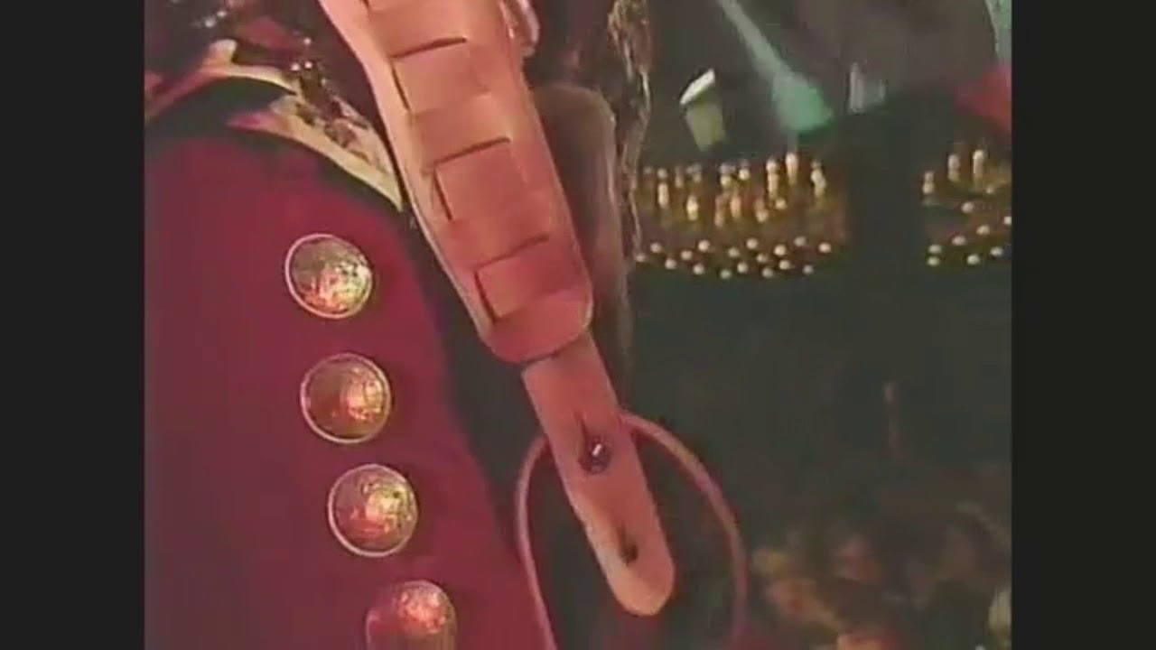 Stevie Ray Vaughan shakes fan's hand while playing Voodoo Child.