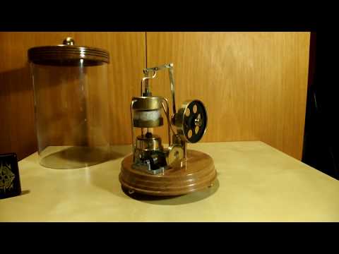 Stirling engine with musicbox in glass tube