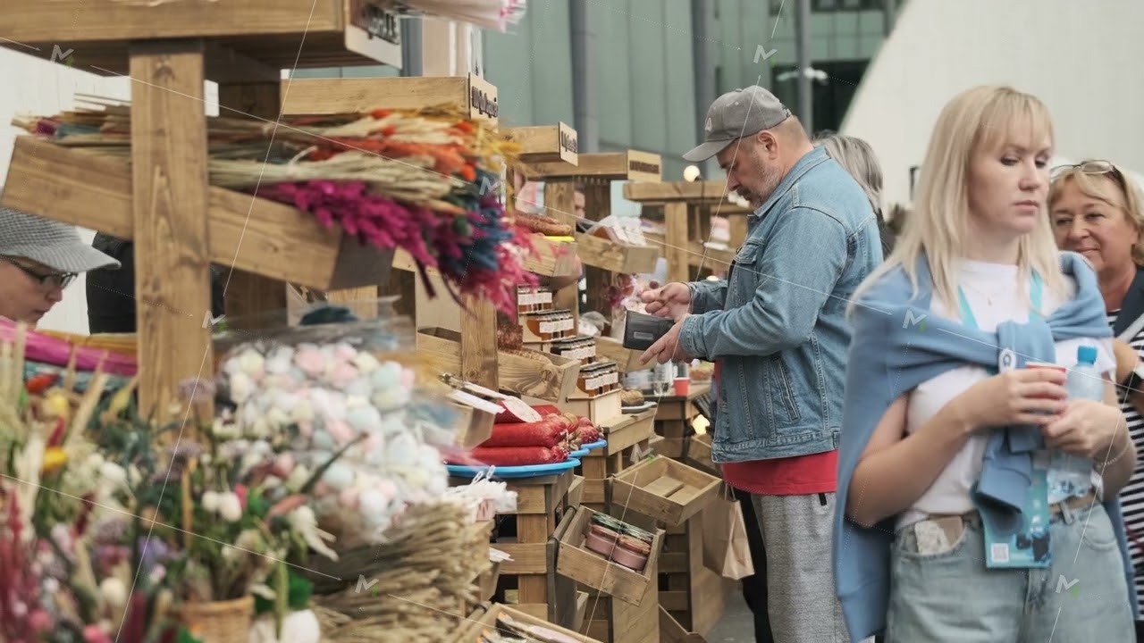 Women Browsing Dried Flower Stalls at a Farmers Market