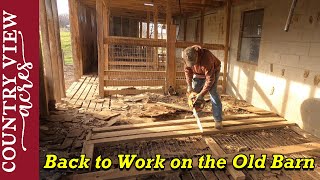 Tearing out the old animal stalls in the Bank Barn.  We've never worked on this section of the barn.