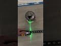 Measuring Up: Workers Utilize Laser Tape Measure and Bluetooth Device for Precision in Construction
