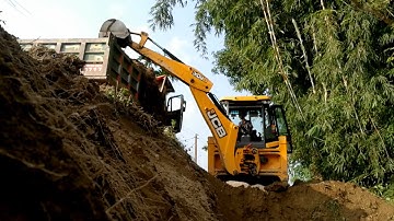 JCB Backhoe Machine Loading Soil In Dump Truck And Making Big Drain  Foundation Construction - Earth