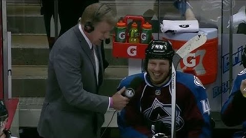 Erik Johnson pets Ryan Wilson with stick
