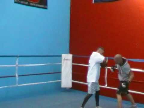 Jonny " Two Gunz " Walker doing pads in preparatio...