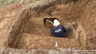 Building a bushcraft survival earth hut with a fireplace inside