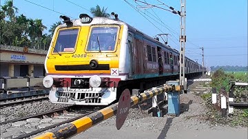 Aerodynamic Headed Furious Speedy EMU Local Train Skip Through Level Crossing Gate | Eastern Railway