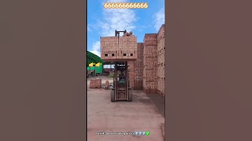 Forklift operator loading pile of bricks