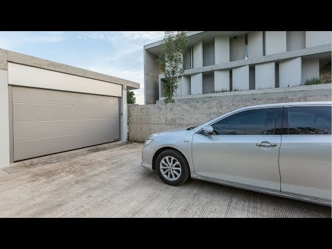 วีดีโอ: ฉันสามารถเปลี่ยนที่เปิดประตูโรงรถแบบโซ่ด้วยตัวขับสายพานได้หรือไม่?