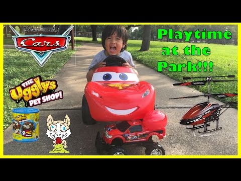 Little Girl (age 1-2) Riding Toy Car In The Playground. Childhood