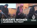 Sudan’s women attend training camps to learn how to fight