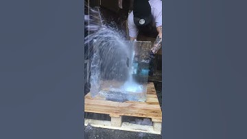 Chainsaw through clear ice for music video