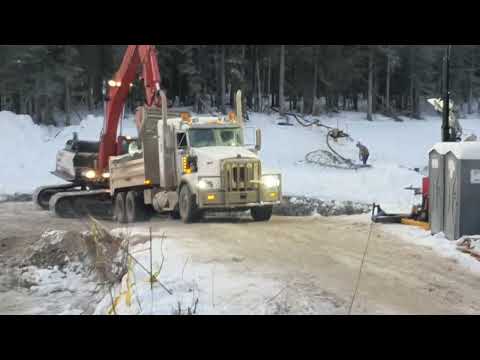 Oil spill cleanup in creek old video footage.