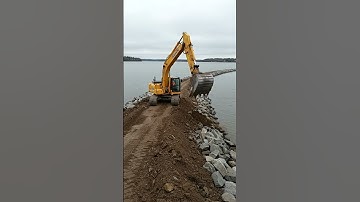 Excavator dredges a riverbed to prevent flooding #shorts #excavator