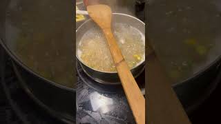 Wooden spoon stops noodles from boiling over!