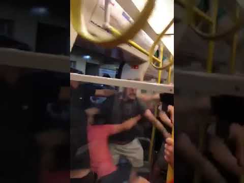 Liverpool and Manchester City fans clash before the game on the London Underground