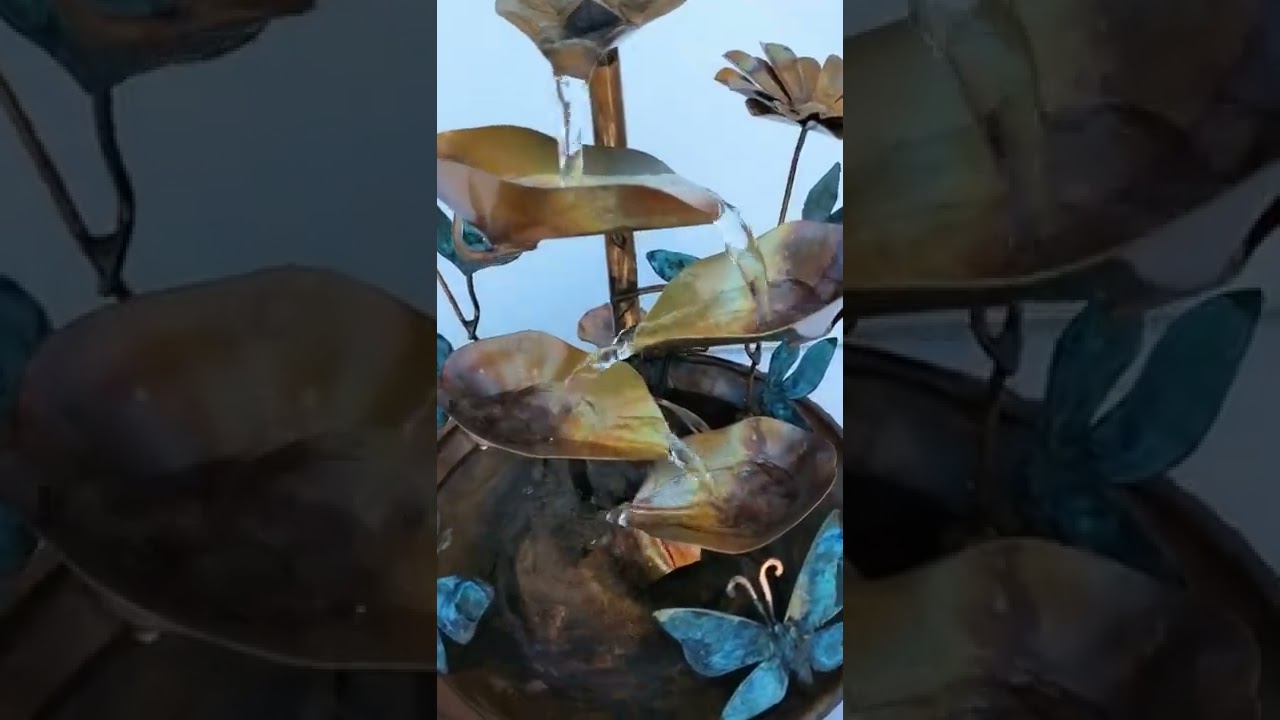 Copper water fountain with daisies and Butterflies, small table size thecopperfountain.com