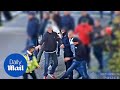 Cctv shows dutch football fans attacking with concrete slabs